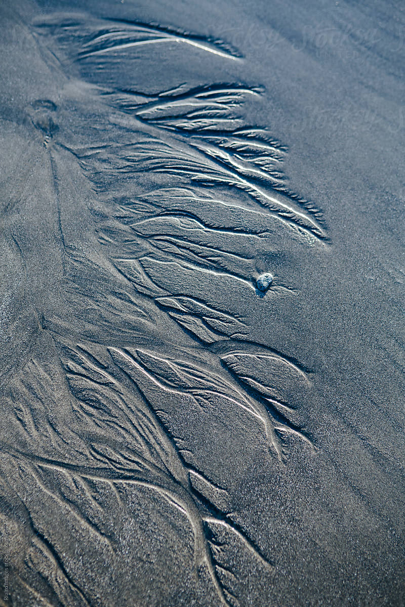 Close up of erosion markings in sand at low tide
