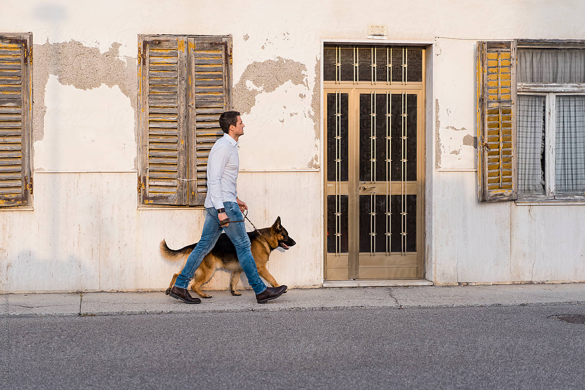 Man walking outdoor with his dog