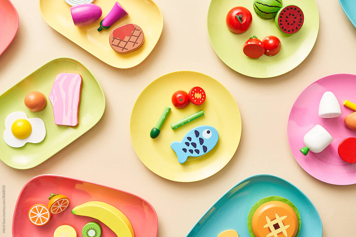Colorful toy food on plates