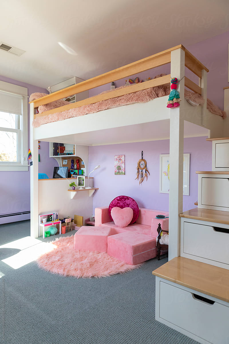 Girl Child\'s purple bedroom interior in home with bunk bed