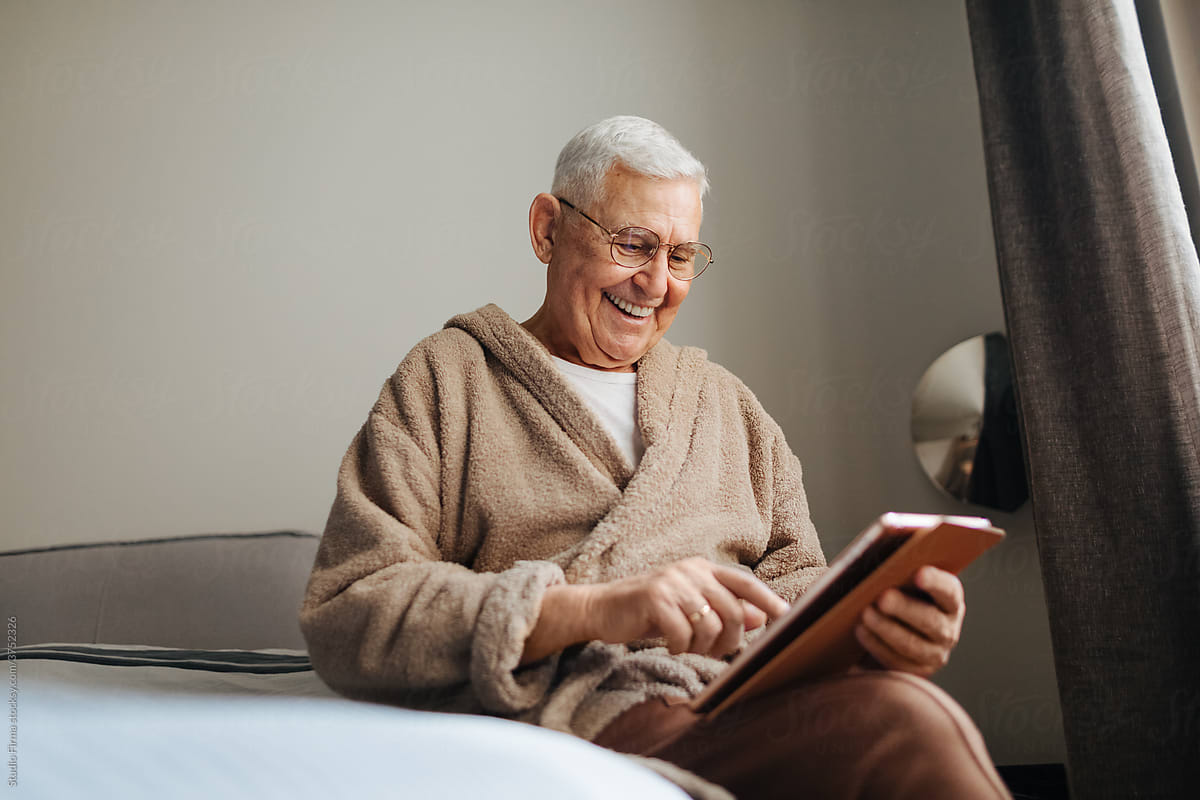 Old Man Using Digital Tablet