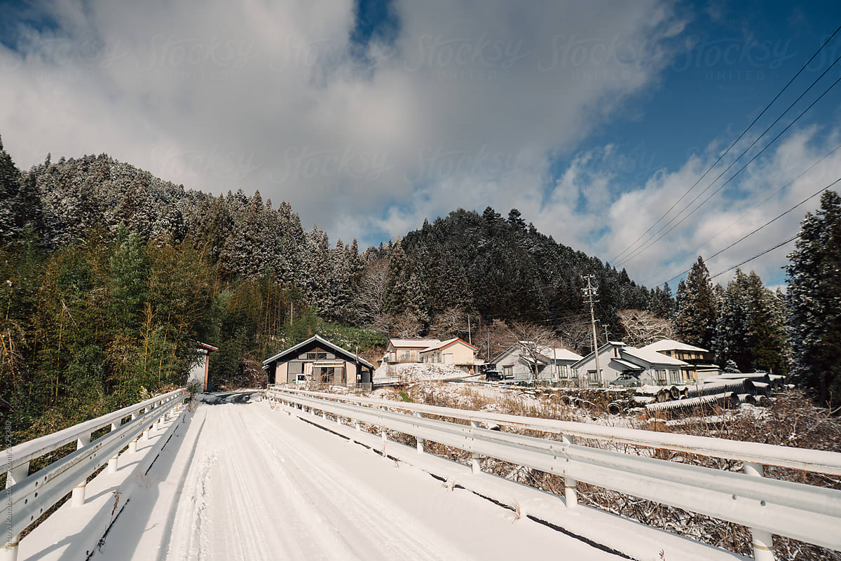 On The Bridge In Japanese Local Village With Snow In Winter Season