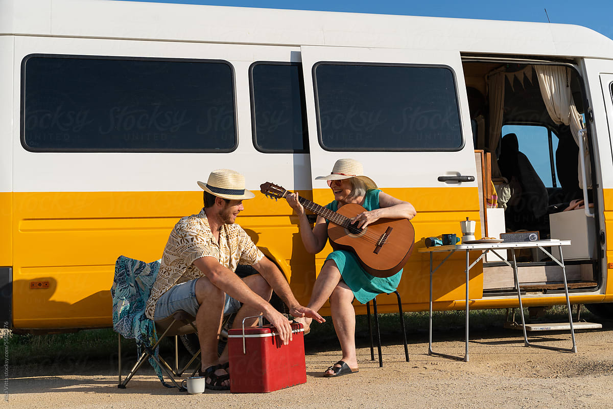 retired woman and son in camper van
