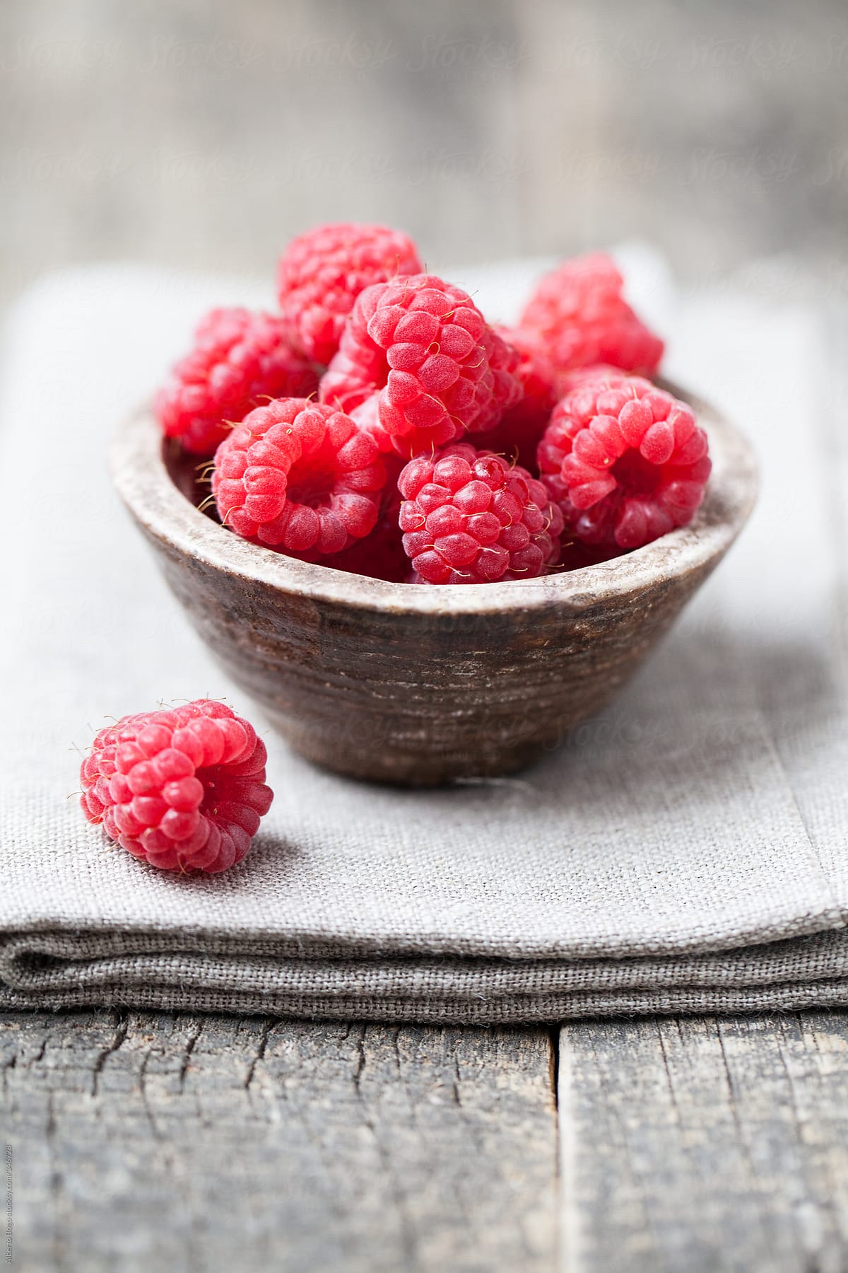 Fresh And Sweet Raspberries on the Rustic Table