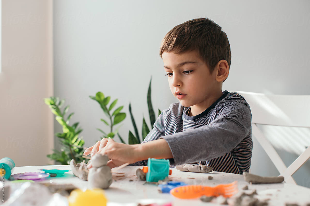 Boy Playing with Modeling Clay