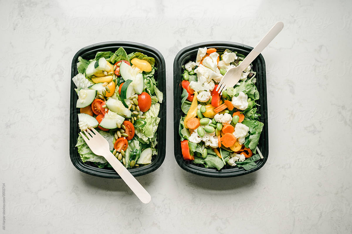 Salad containers prepped for healthy meal planning