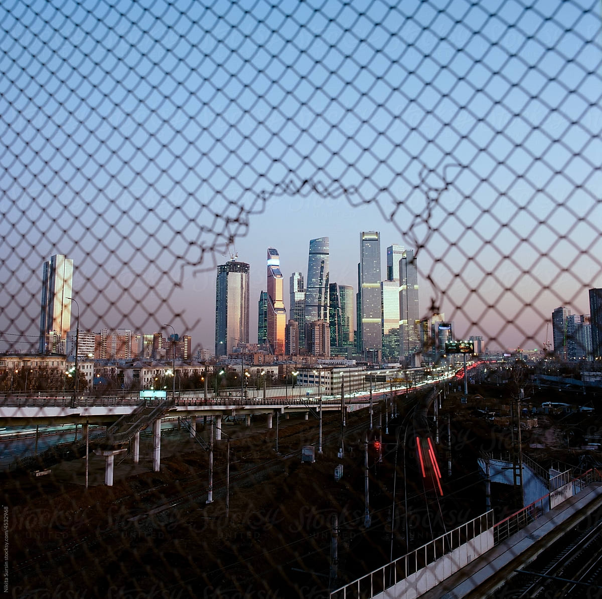 View Of City Seen Through Chainlink Fence in Moscow, Russia
