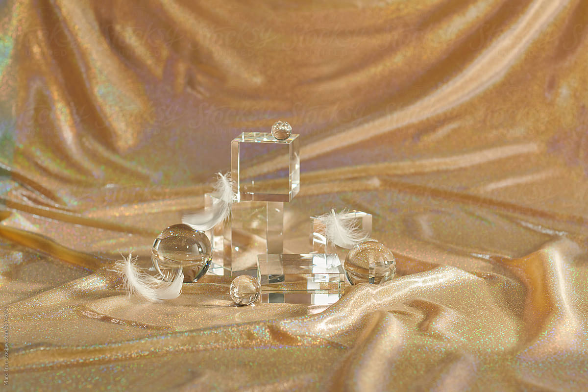 Acrylic empty podium for product presentation on golden background