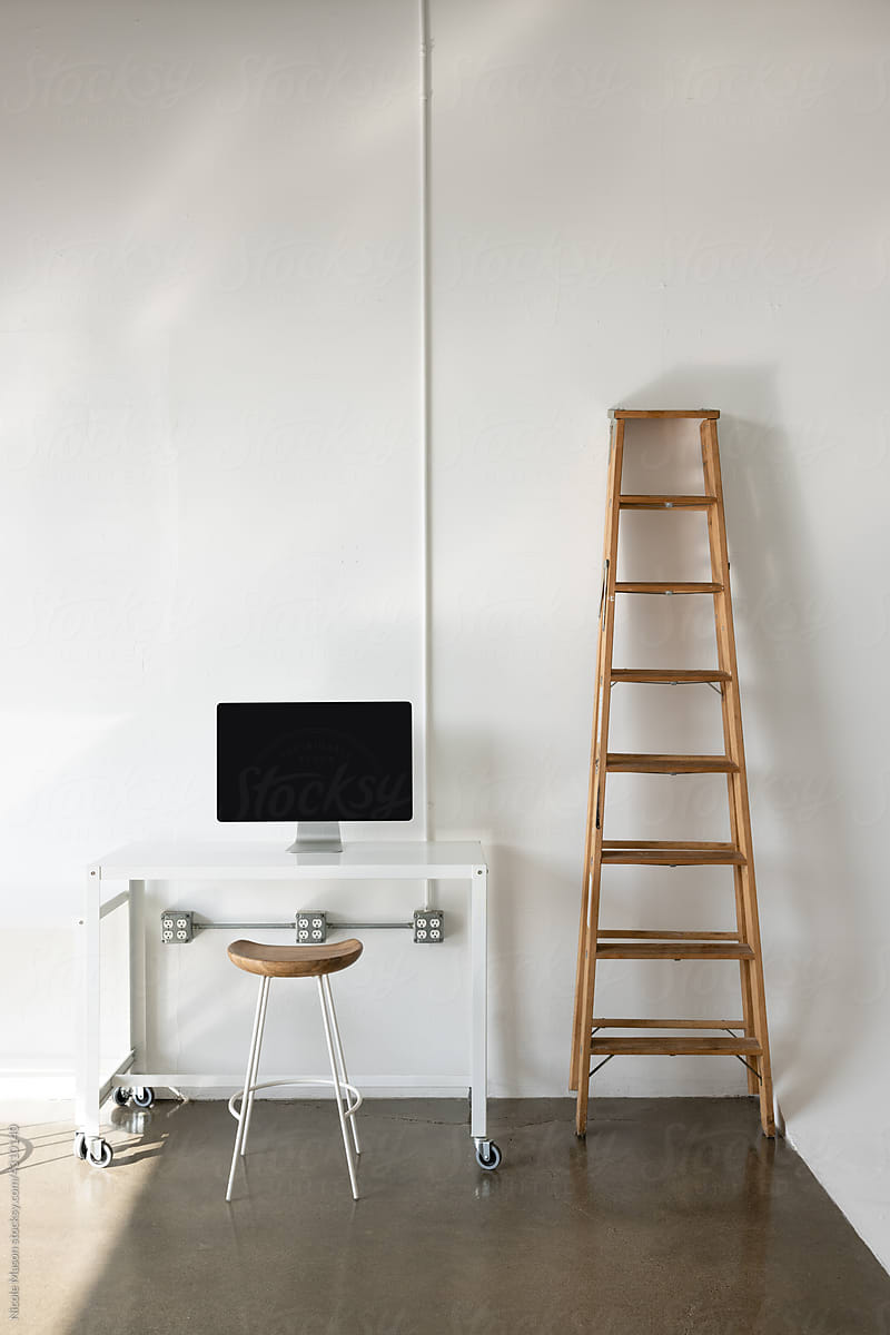 desk with monitor and wood ladder in photo studio
