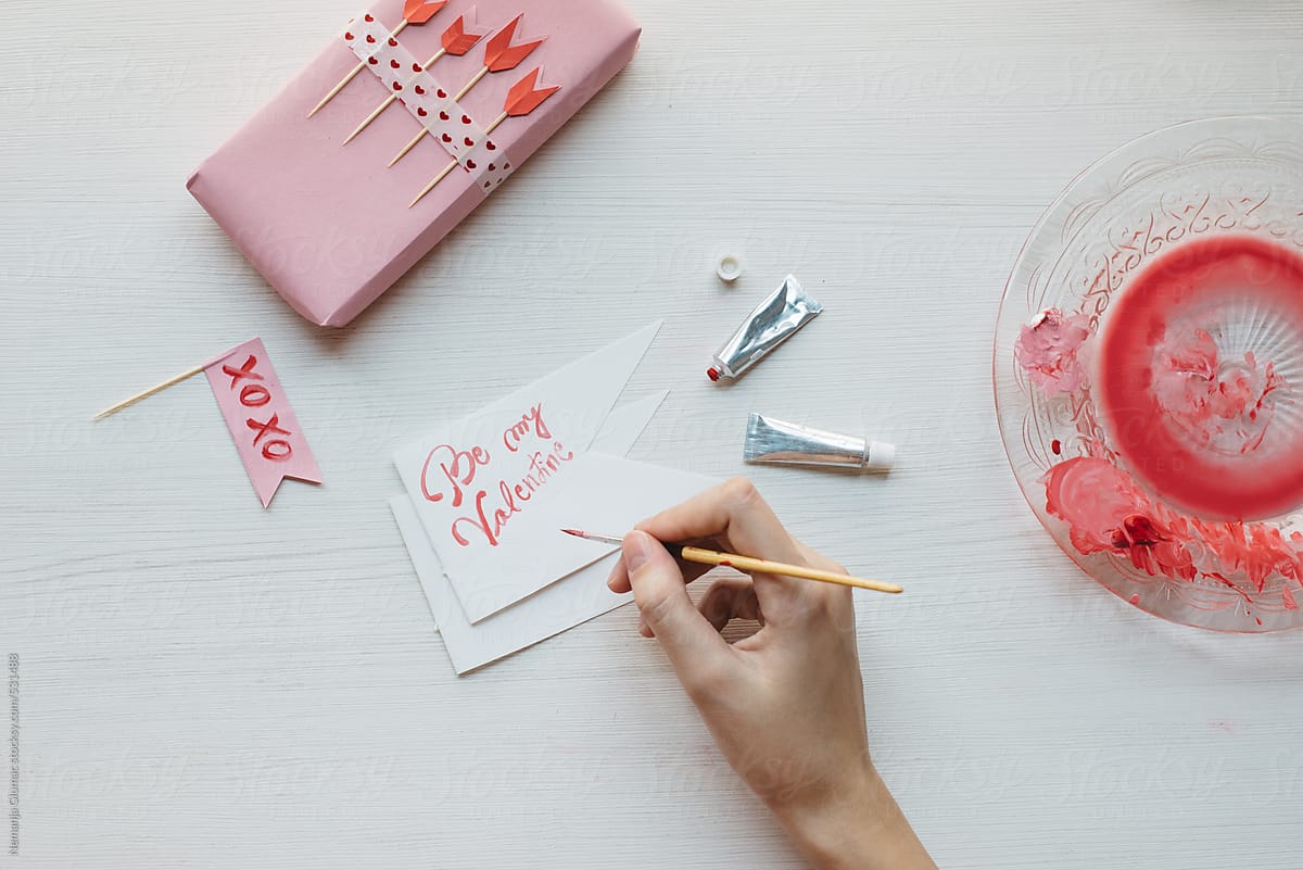 Woman Painting Valentine's Day Card With Watercolors