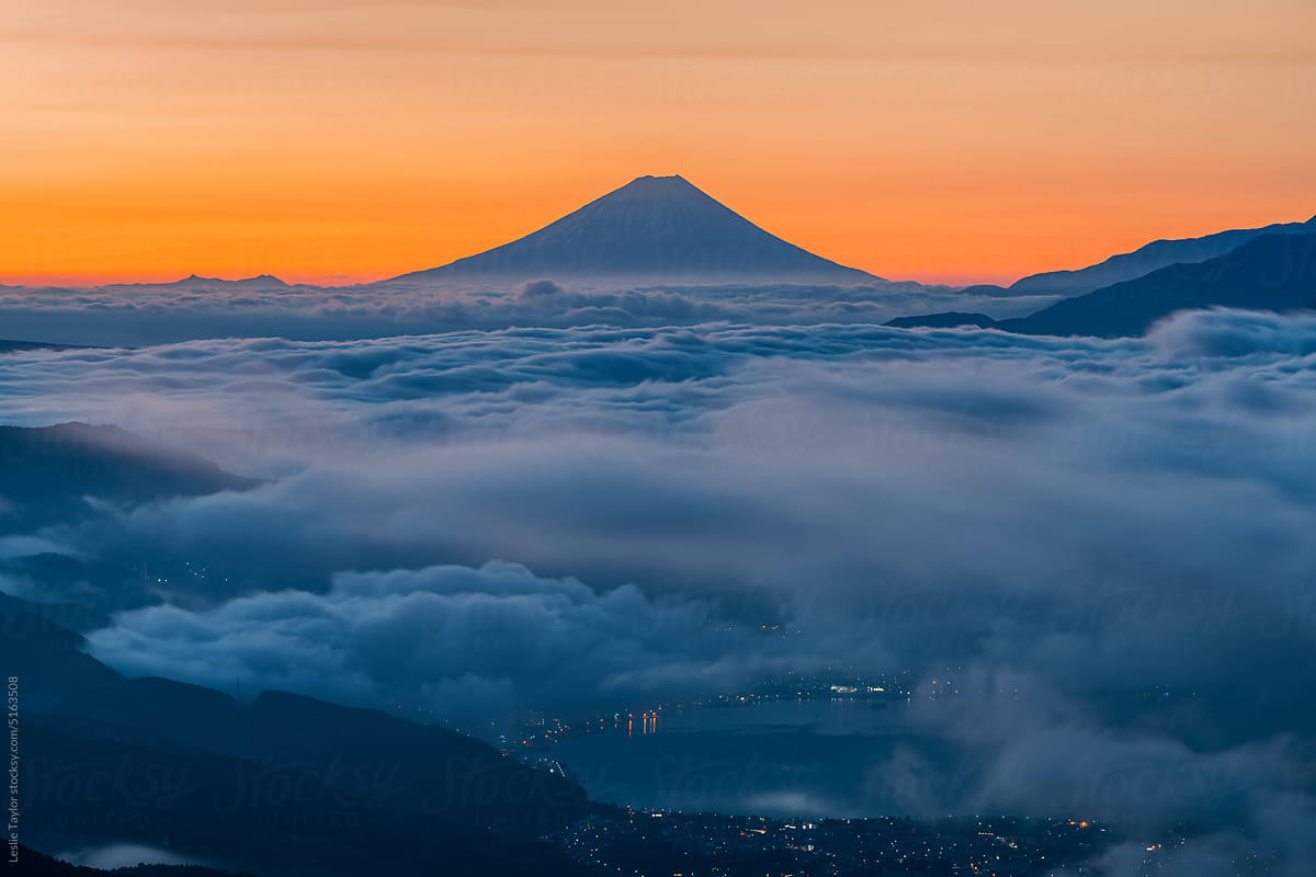 Mt Fuji And Morning Clouds Over A Lake