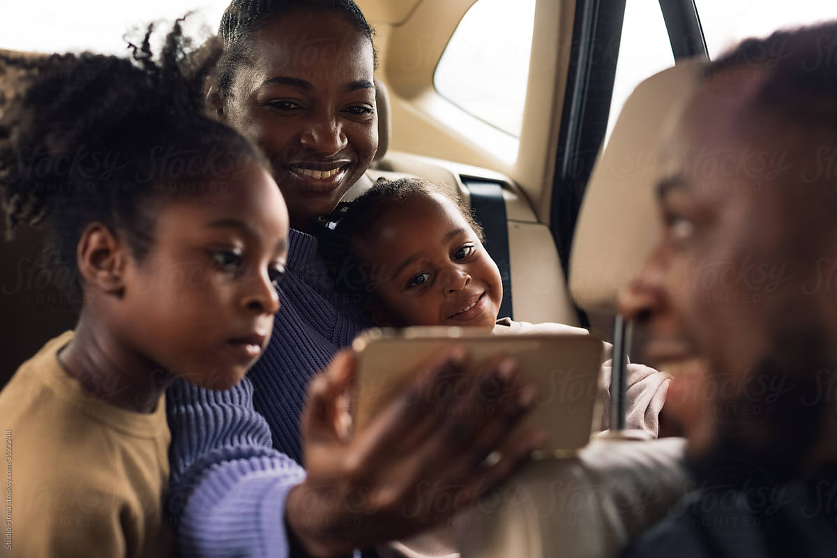 A Family Having a Video Call in the Car