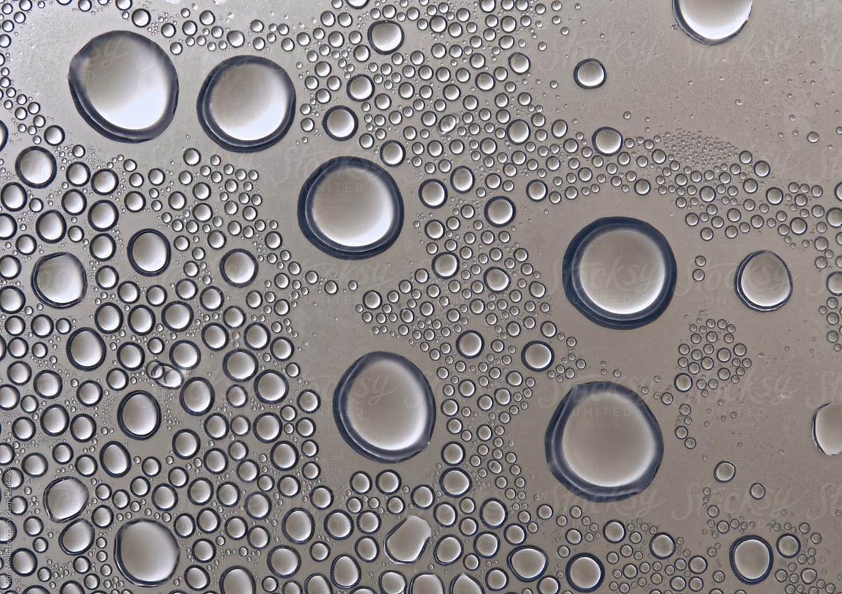 Closeup macrophotograph of water condensation on underside of plastic lid