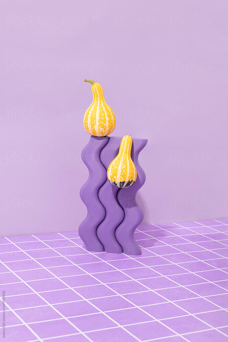 Yellow ornamental gourds with wavy object and purple tiles.
