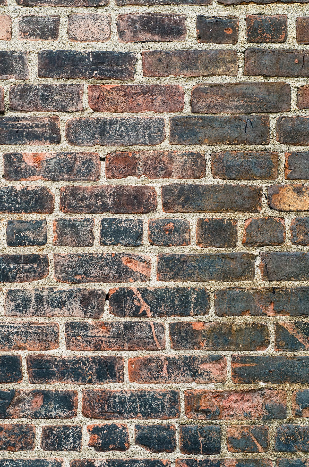 old, scratched, handmade brick wall