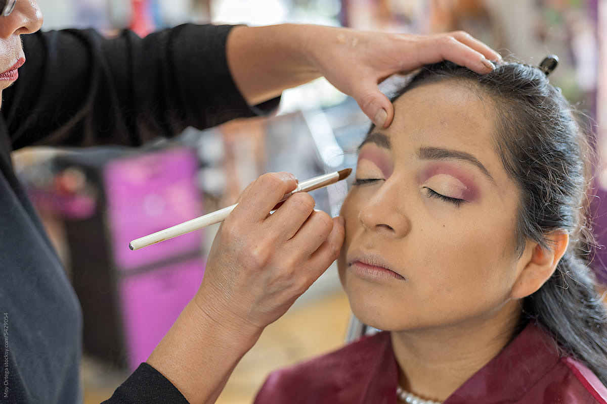 Makeup Artist Retouching A Client\'s Eyelids