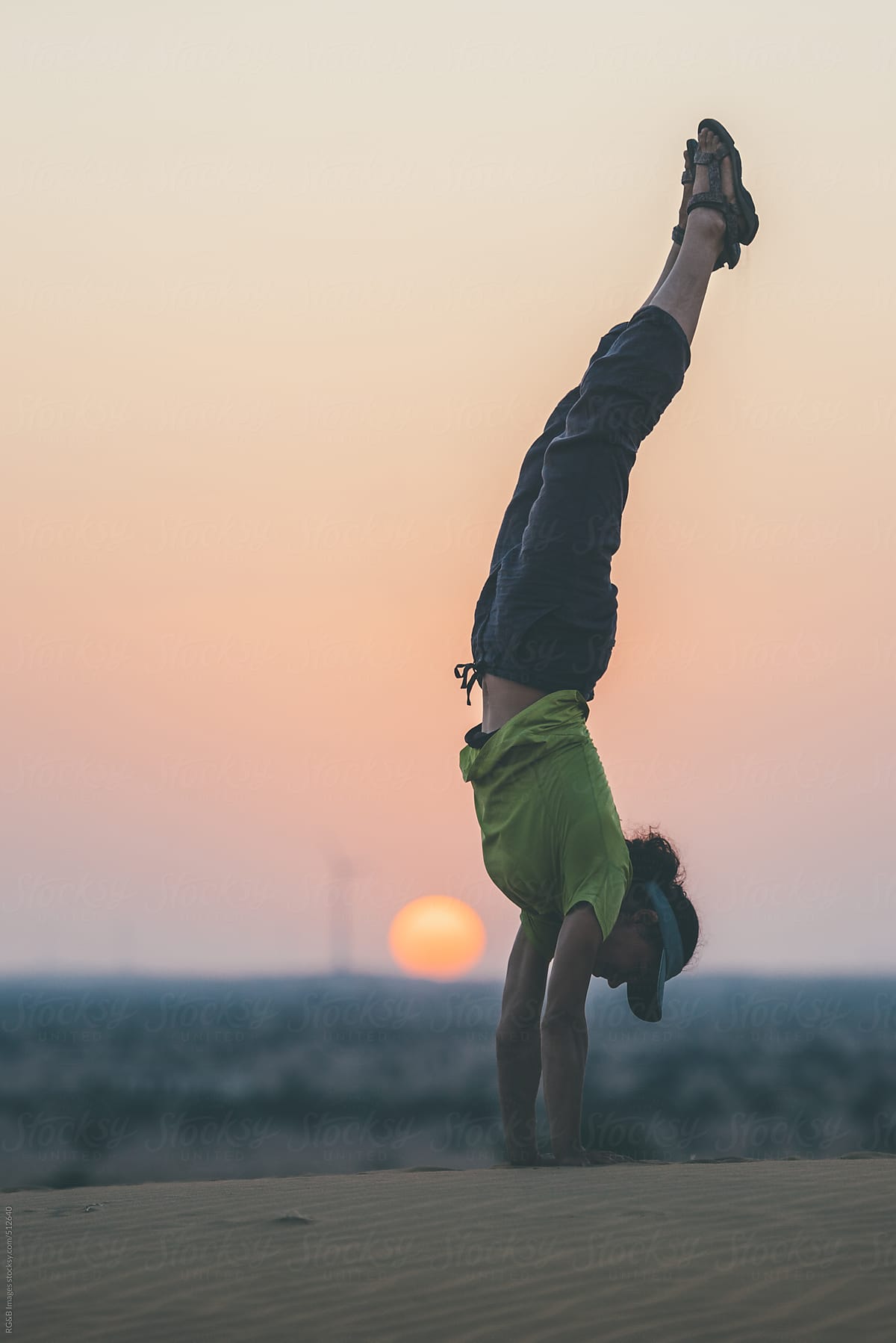 handstand in the desert at sunset