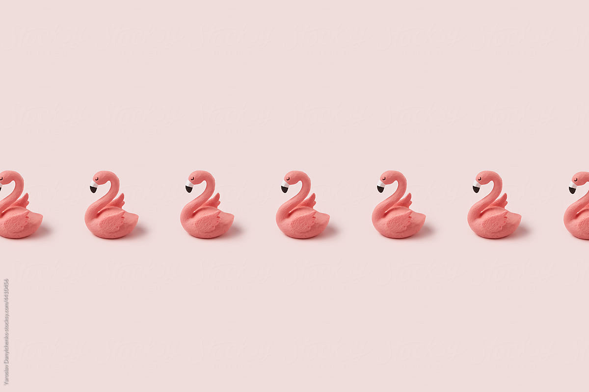 Row of pink easter flamingo on pastel background