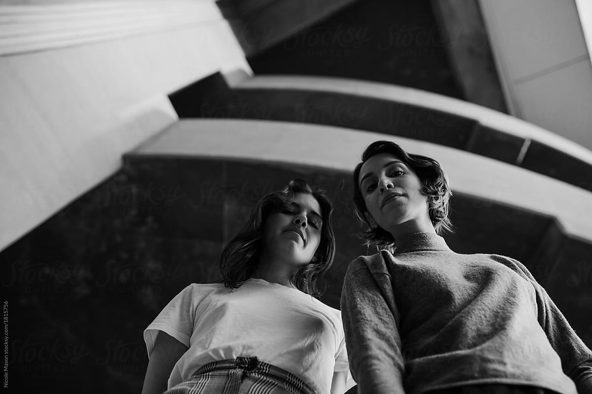Two Stylish Women Looking Down At Camera From Above By Stocksy Contributor Nicole Mason