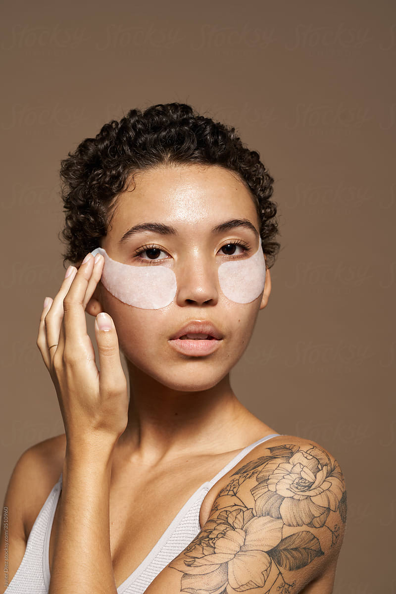 African American woman with cosmetic patches on face