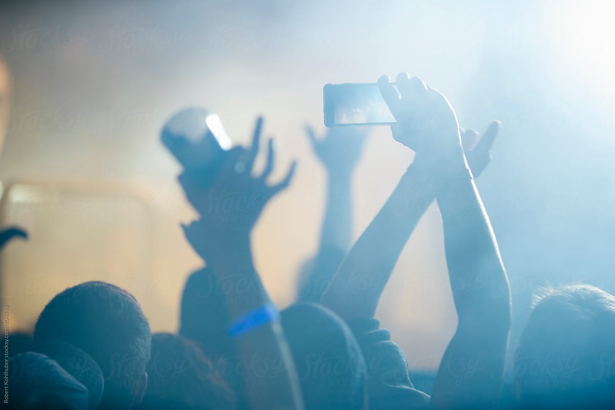 Making photo, video with cell phone at live music concert, festival