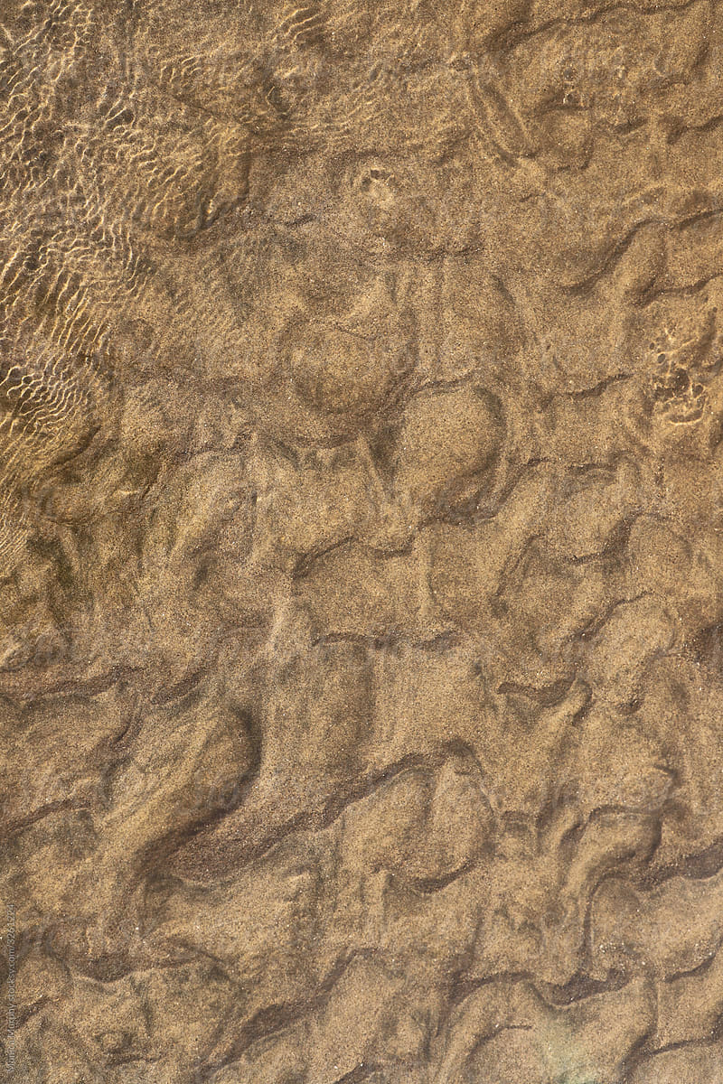 Sand formations under shallow ocean water