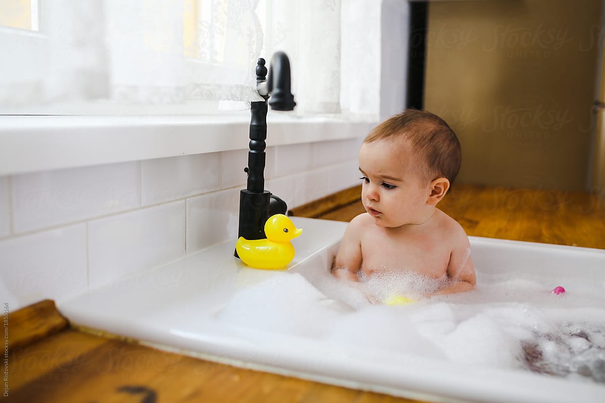 Baby Having A Bath In The Kitchen Sink By Dejan Ristovski