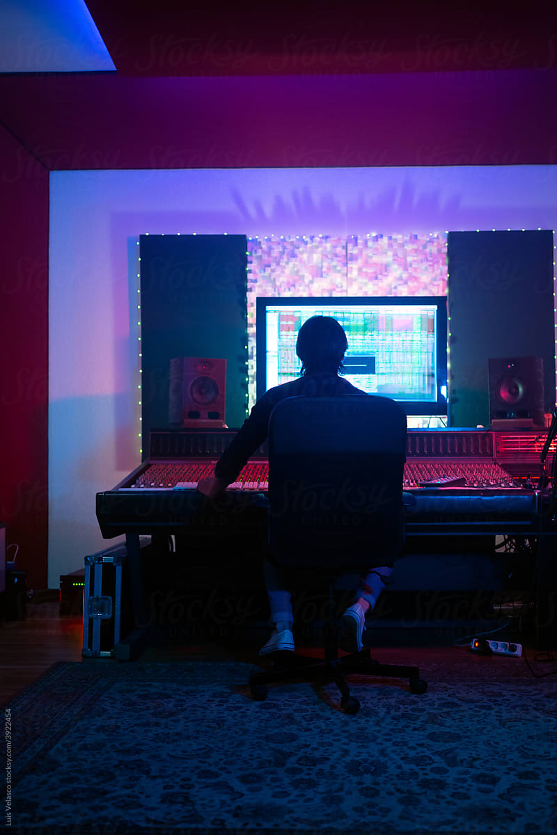 Music Producer Working With A Mixer Sound Software In The Studio.