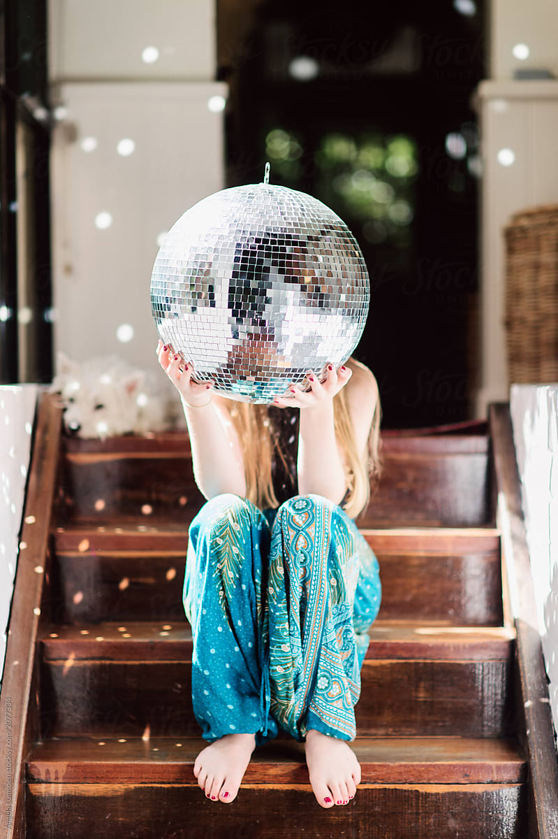 Teenage Girl Holding A Large Disco Mirror Ball By Angela Lumsden