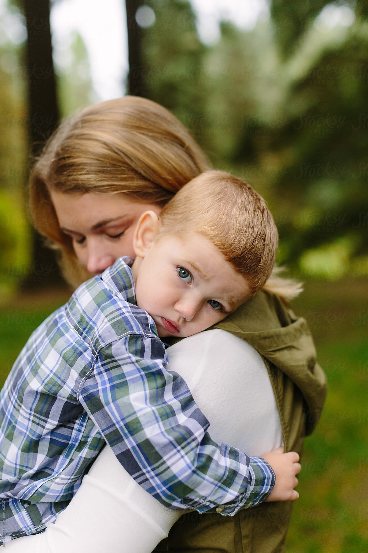Little Boy Cuddling With Mom by Stocksy Contributor Leah Flores