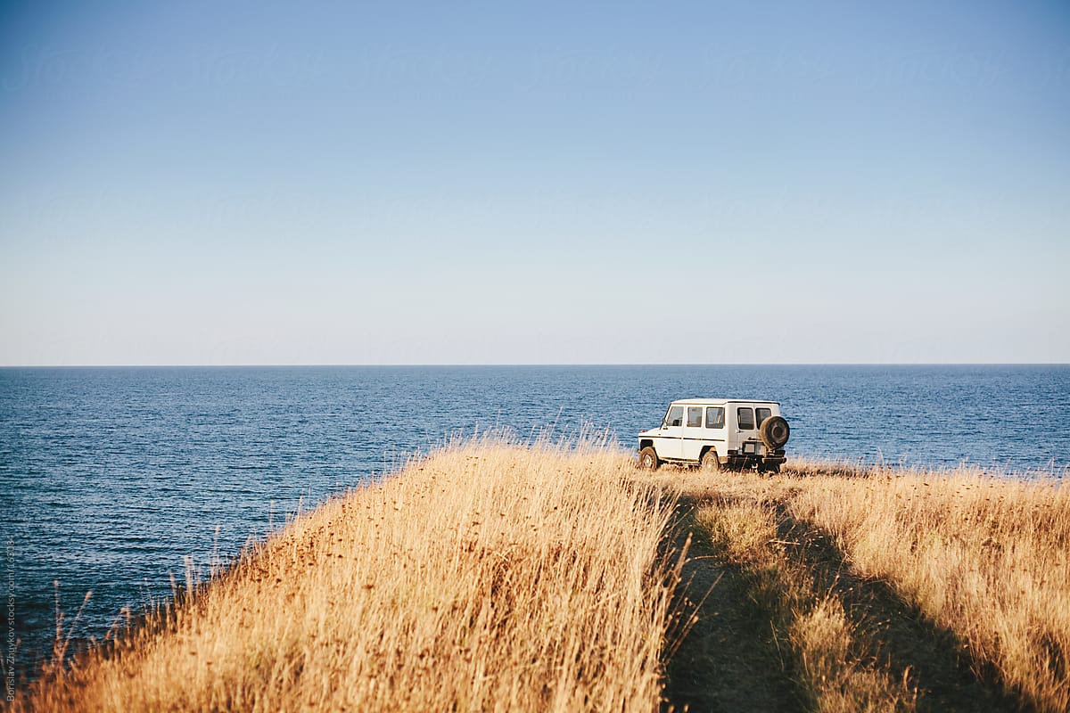 Car on the hill at the sea