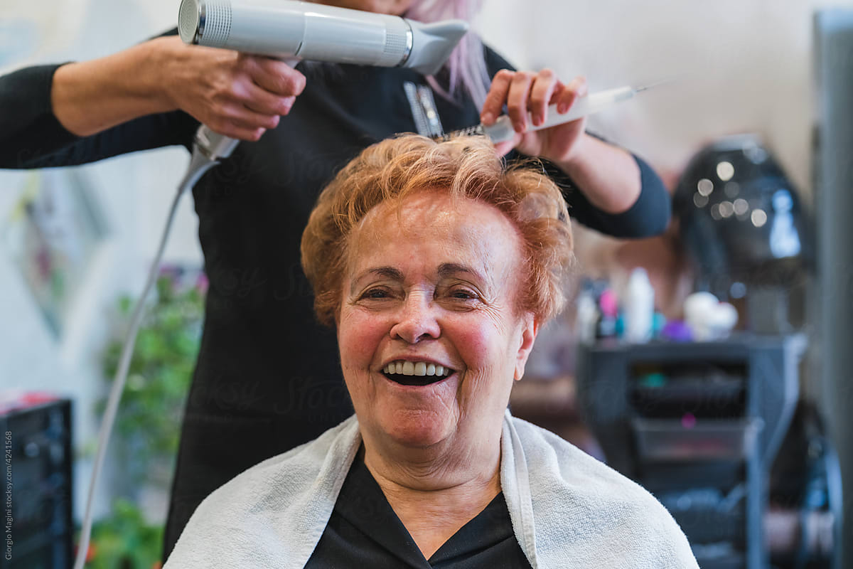 Happy Elderly Woman at the Hairdresser Salon