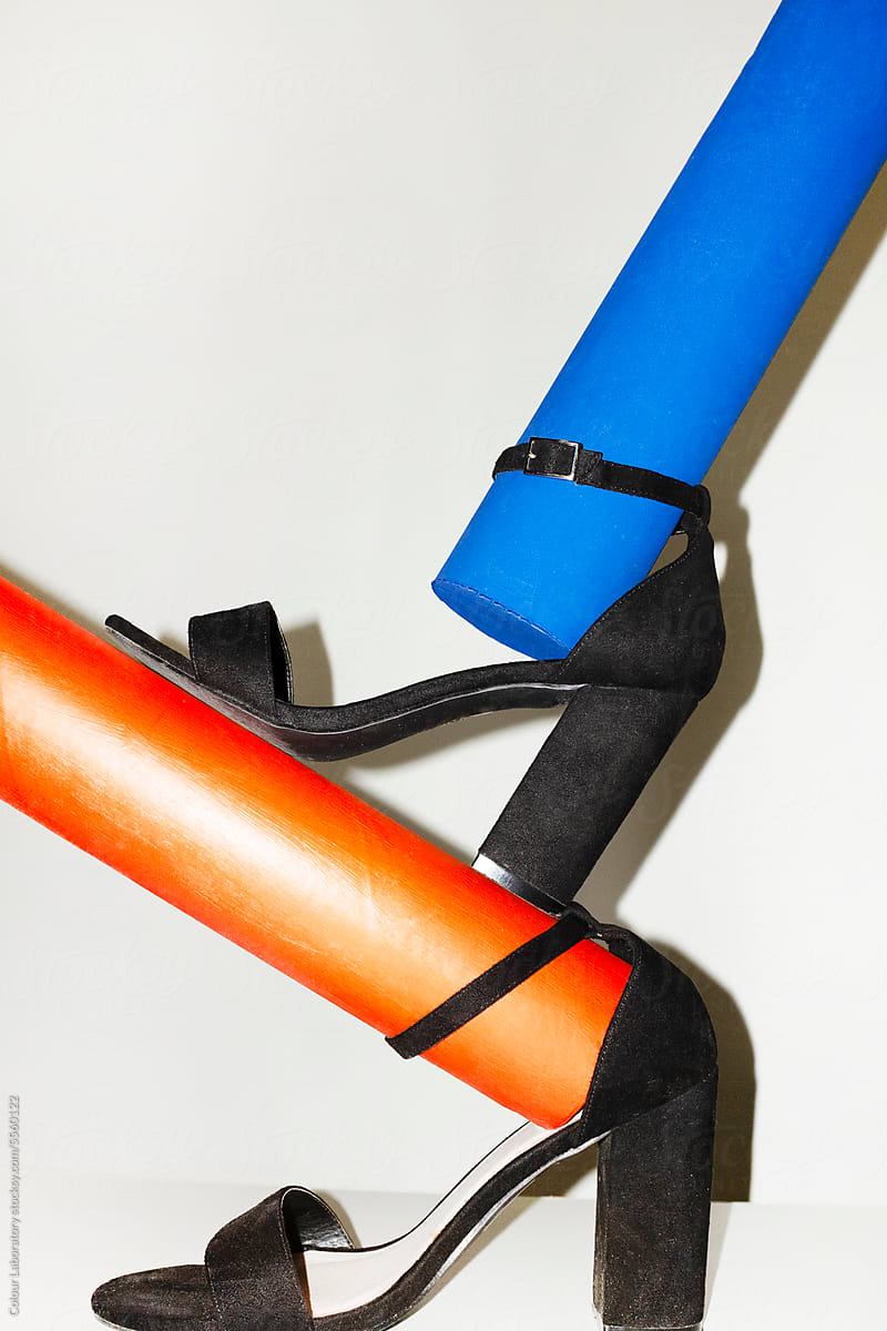 Black classic suede heels and colorful tubes with hard direct flash