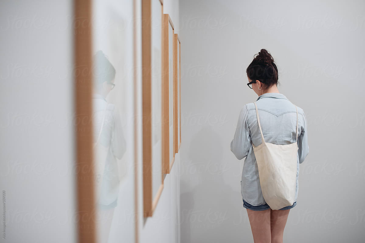 Girl Browsing In Art Gallery By Stocksy Contributor Aila Images