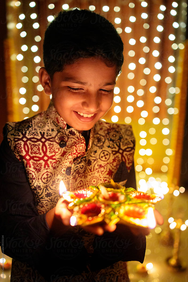 Smiling young boy celebrating diwali