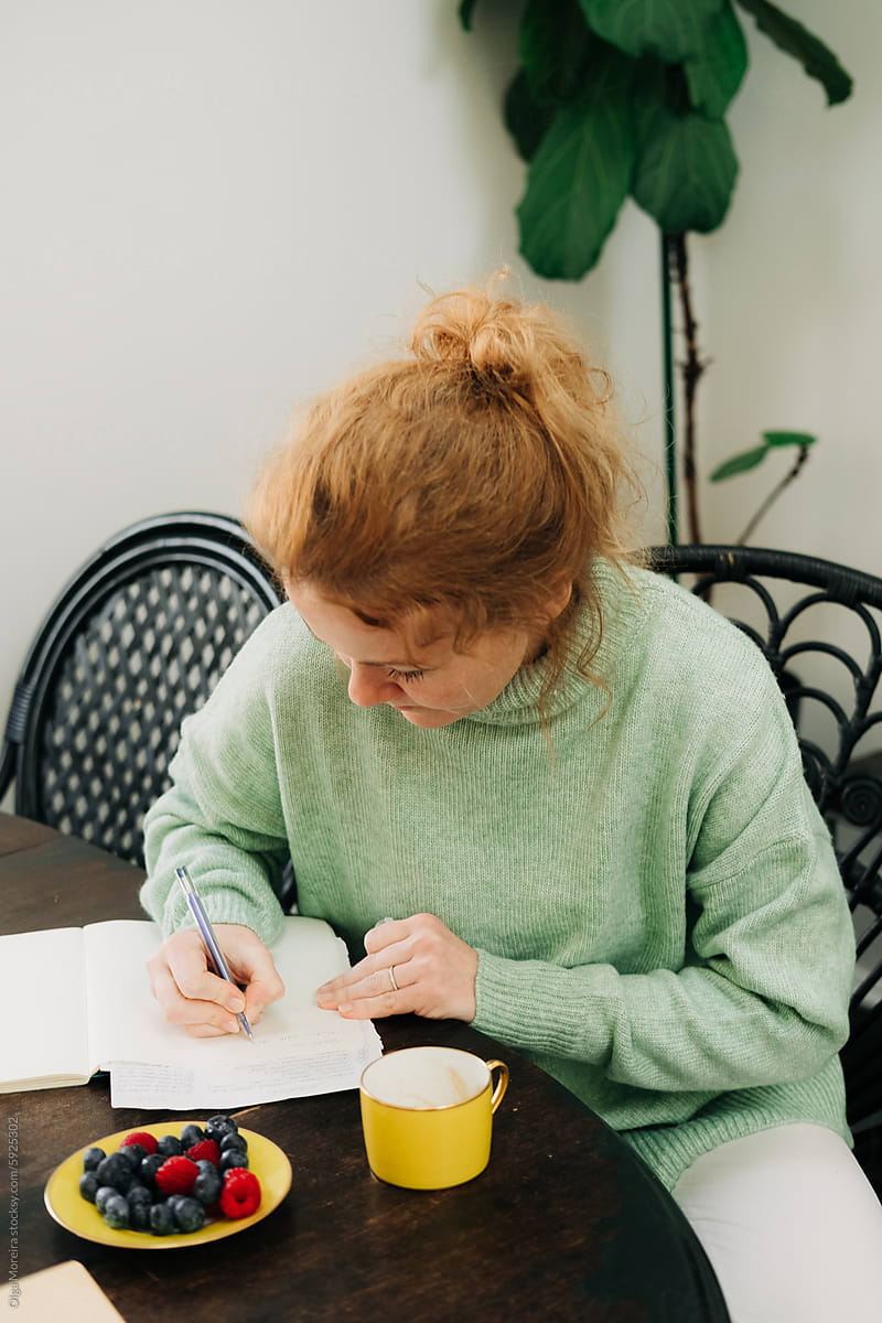 Woman journaling at home