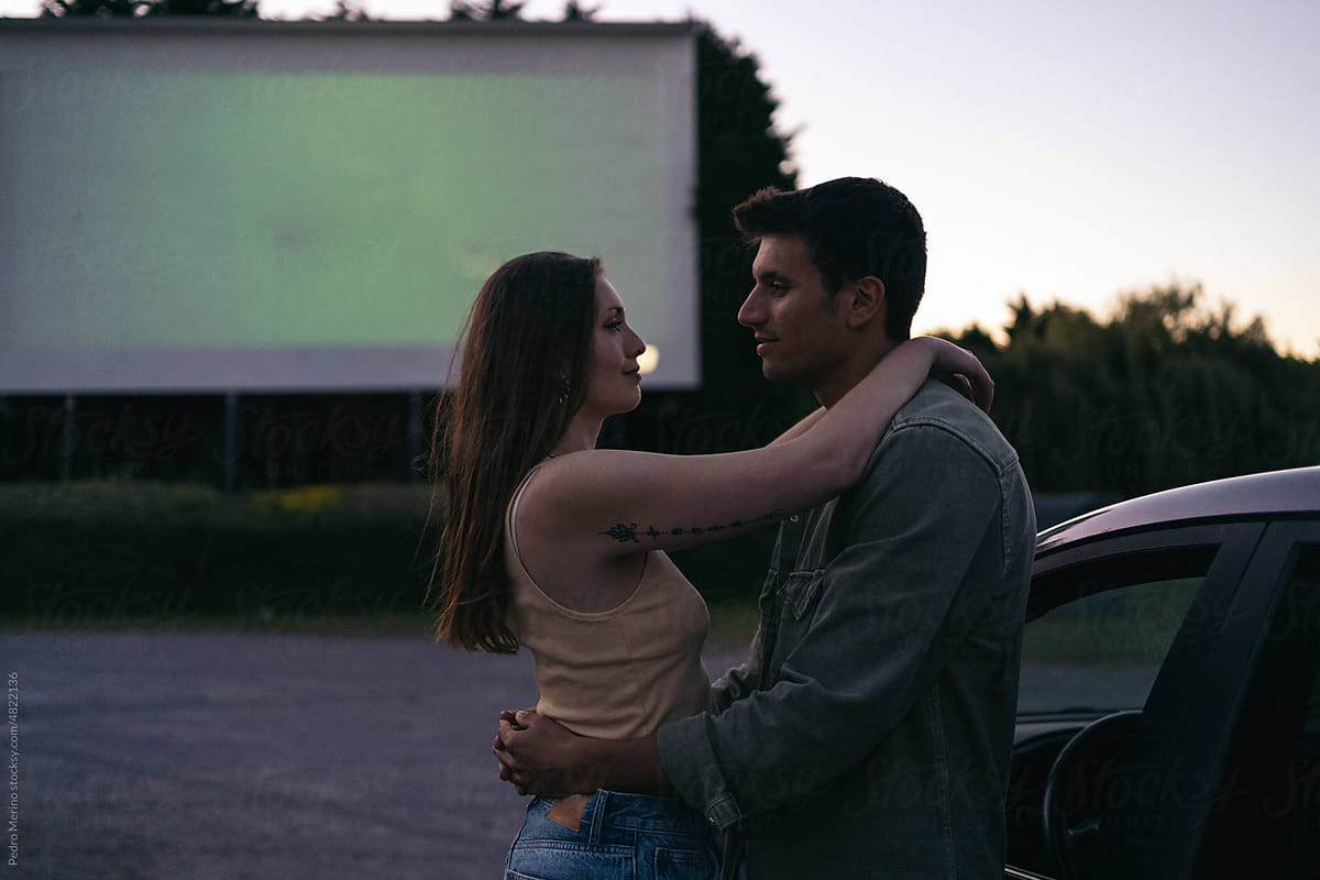 Lovely couple dating at a drive-in cinema
