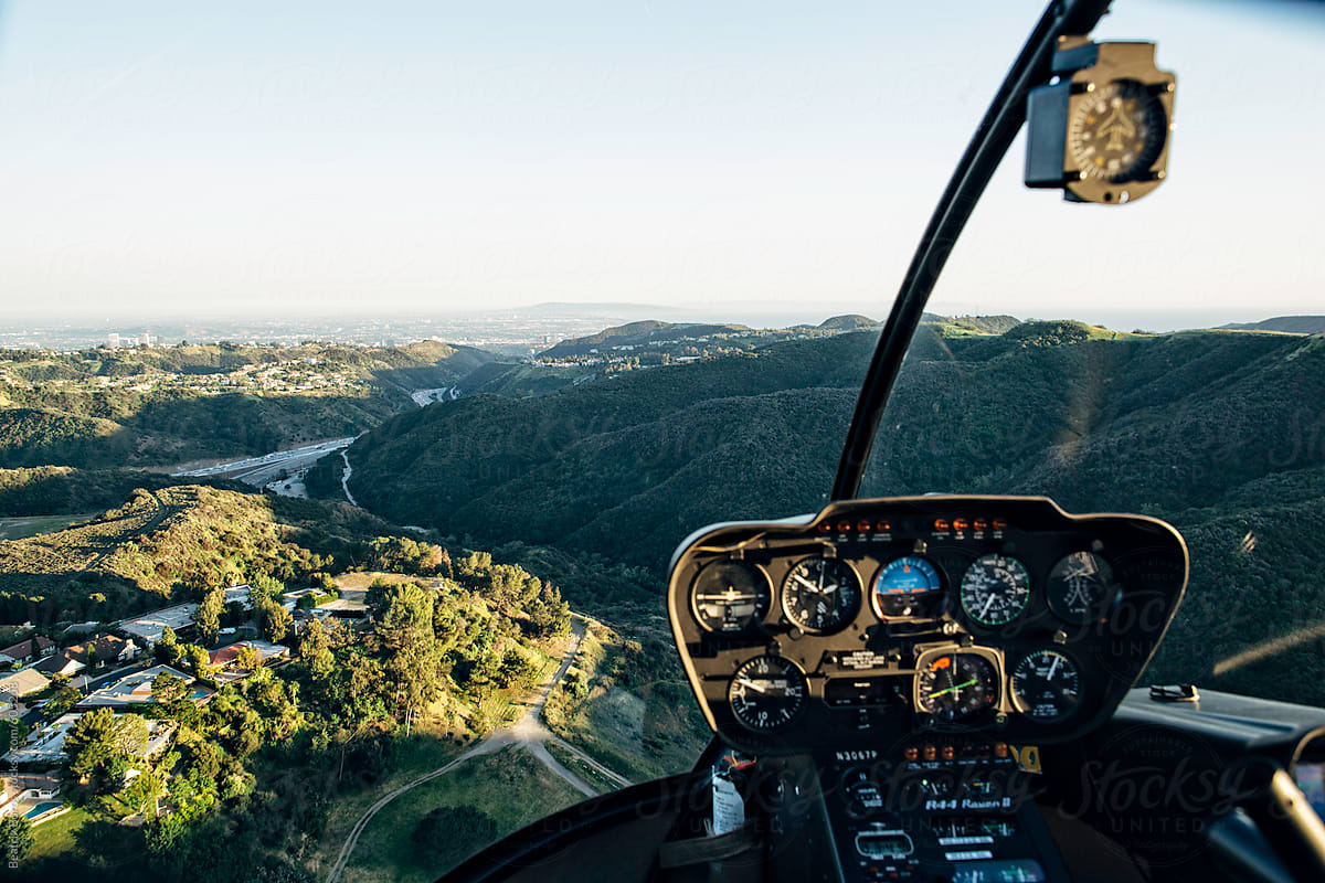 View of the Los Angeles hills from a helicopter with its control panel