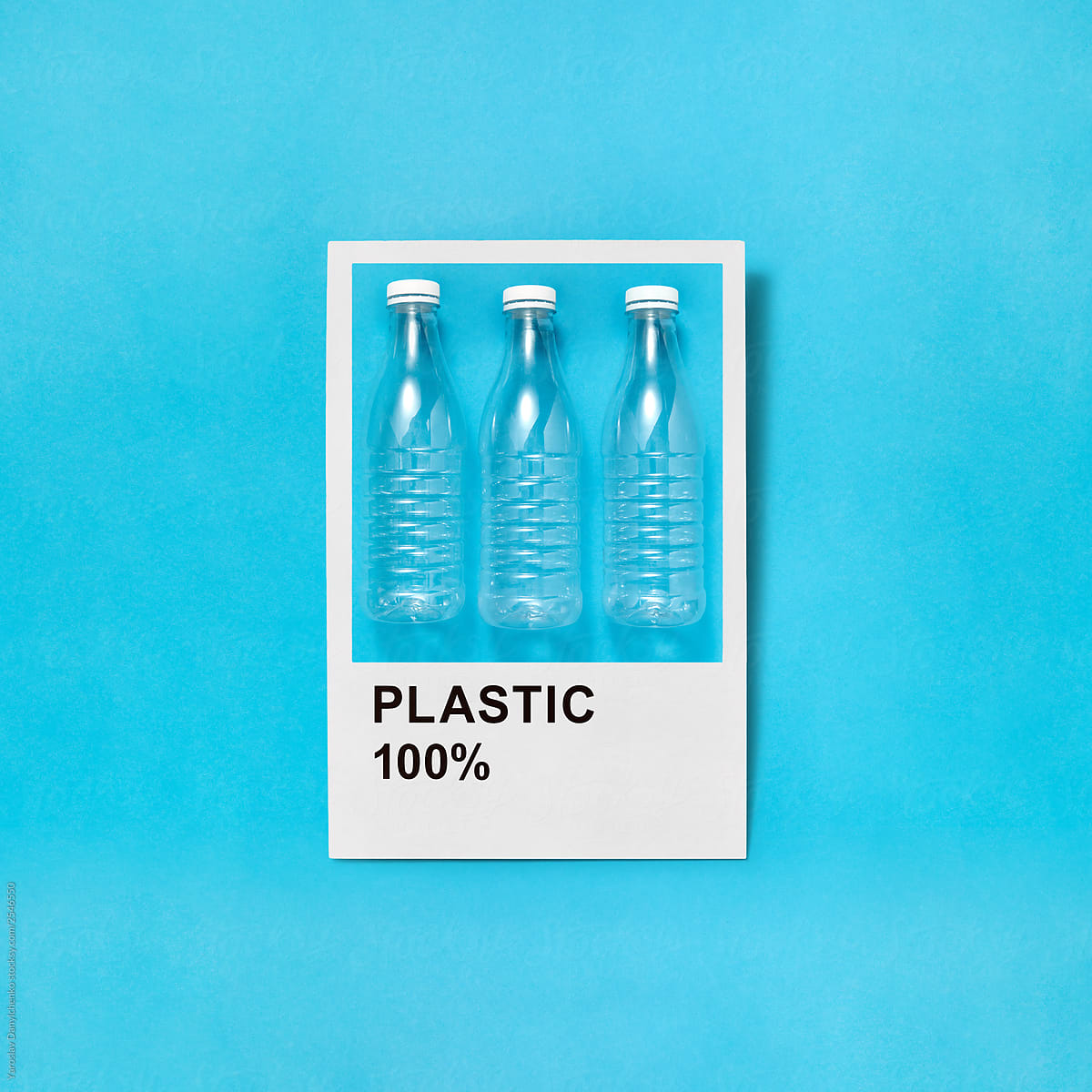 Plastic bottles in a frame on a blue background