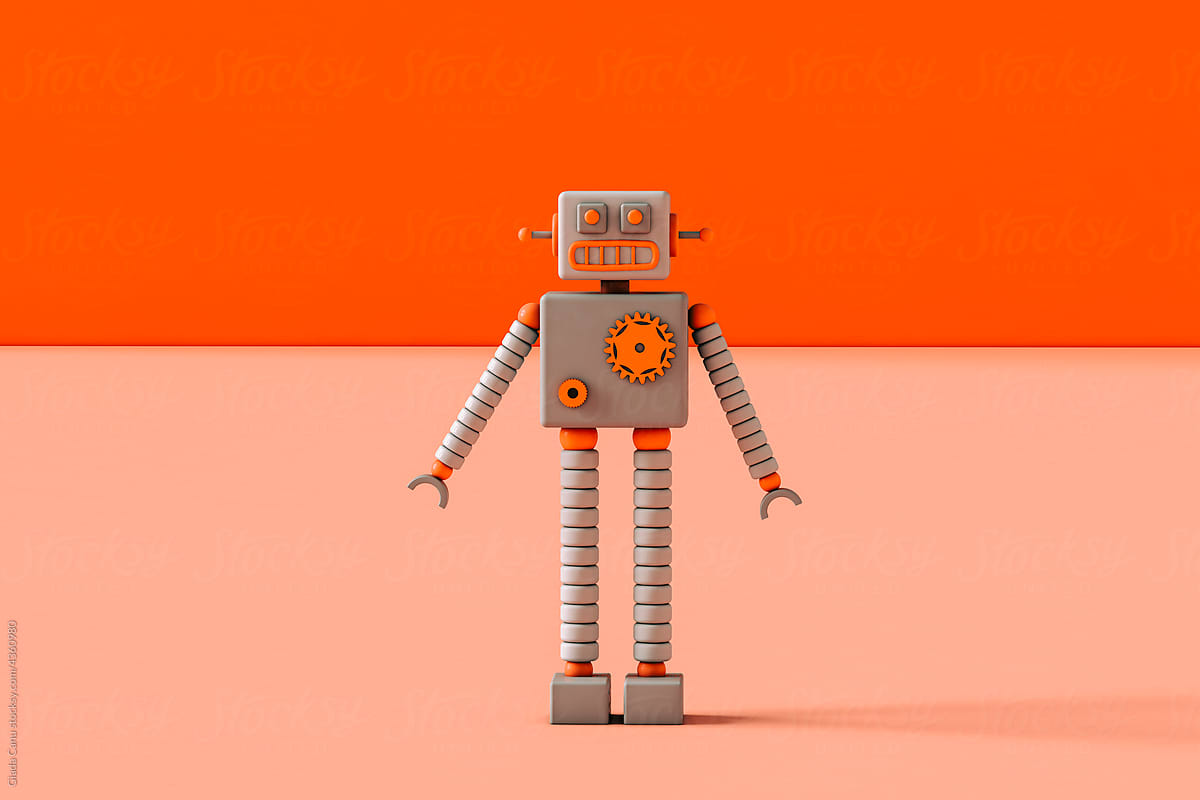 Toy robot on a pink background with copy space