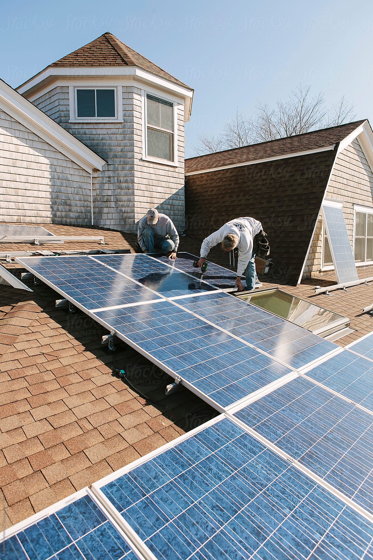 Solar Panel with blue collar labor Installation on roof of Home