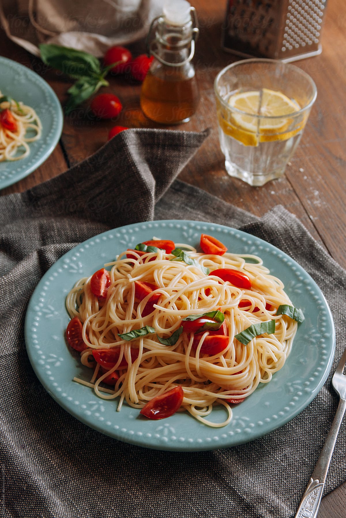 Spaghetti pasta with cherry tomatoes and basil
