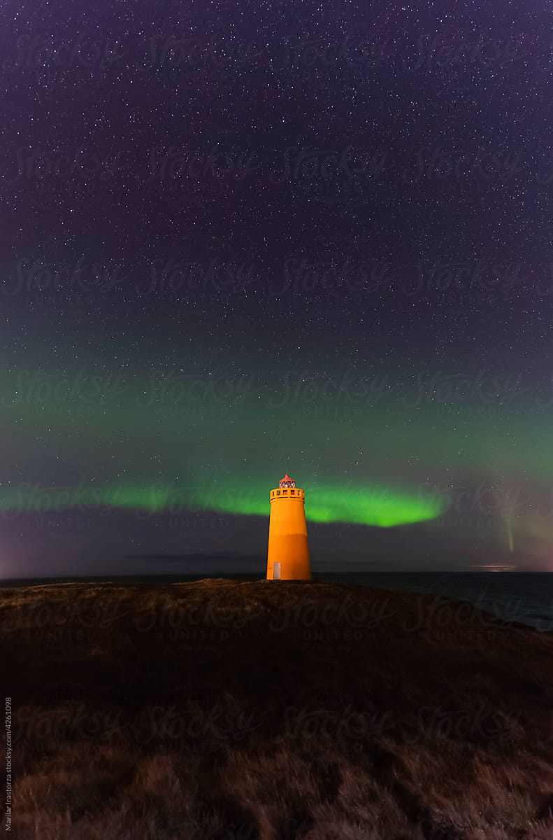 Aurora Borealis Over A Lighthouse