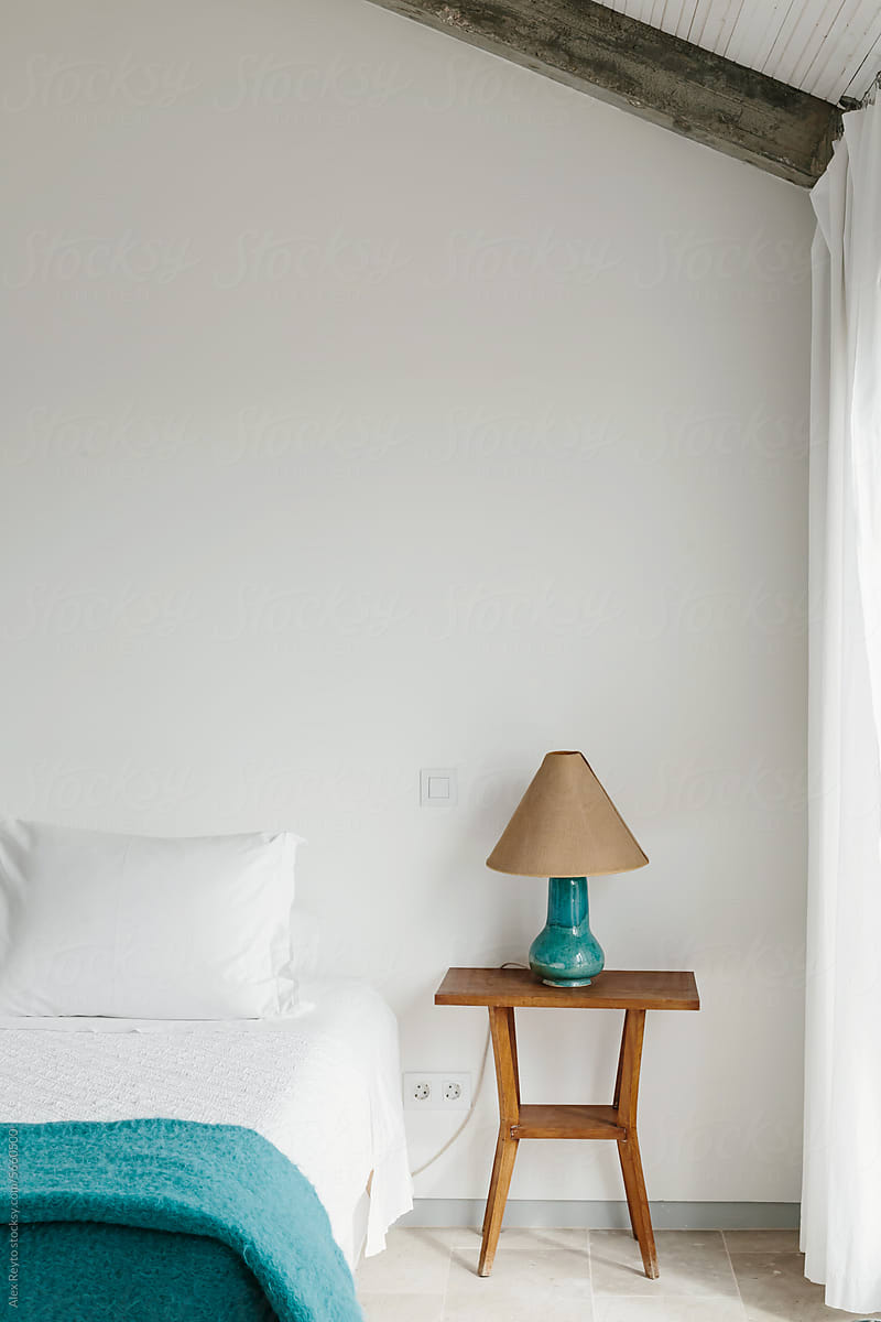Clean, minimally styled guestroom in boutique hotel in Lisbon.