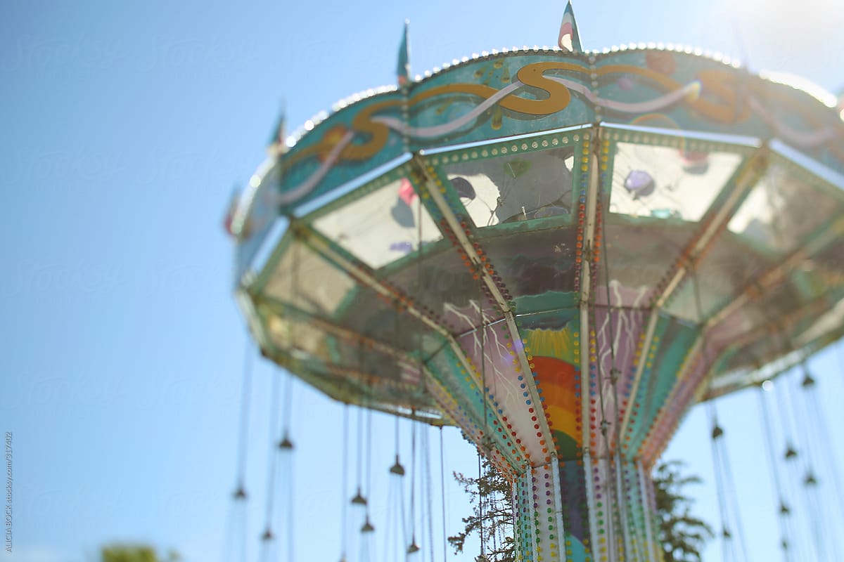 A Colorful Carnival Swing Ride On A Sunny Summer Afternoon