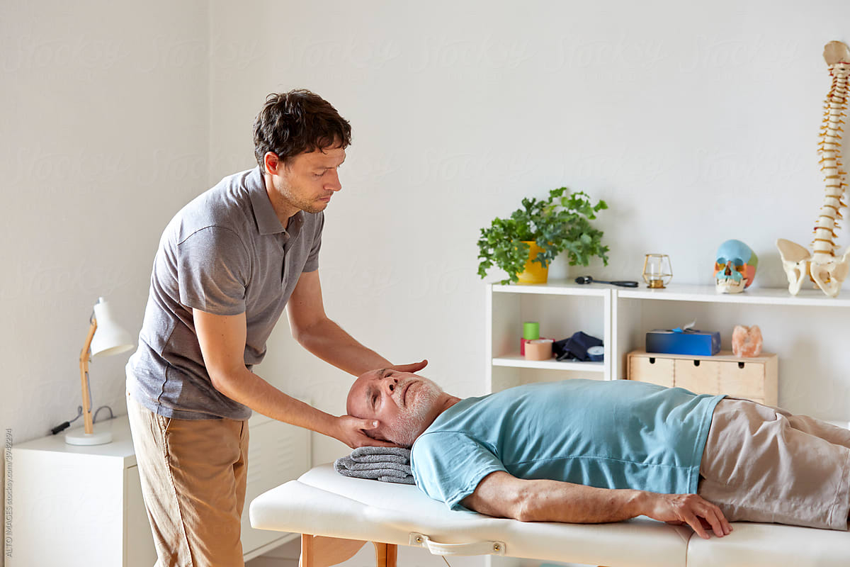 An osteopath treating cervical pain