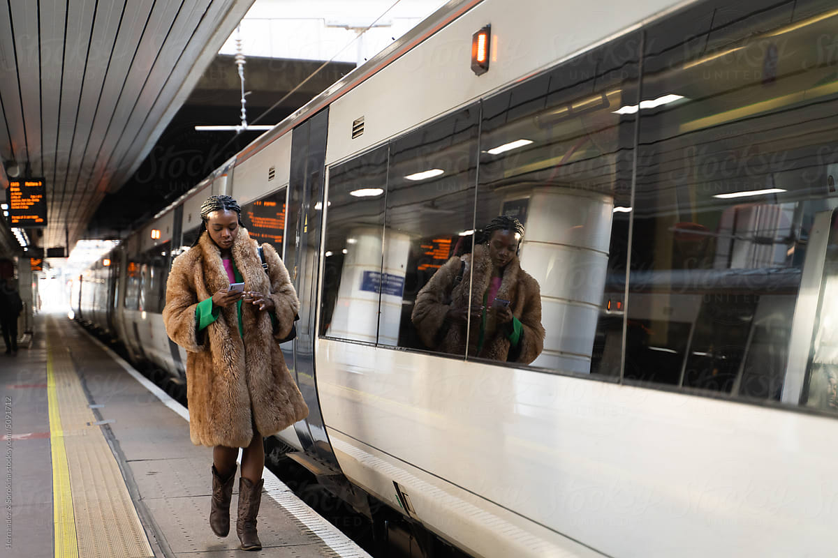 Woman Walking At Railway Station In London