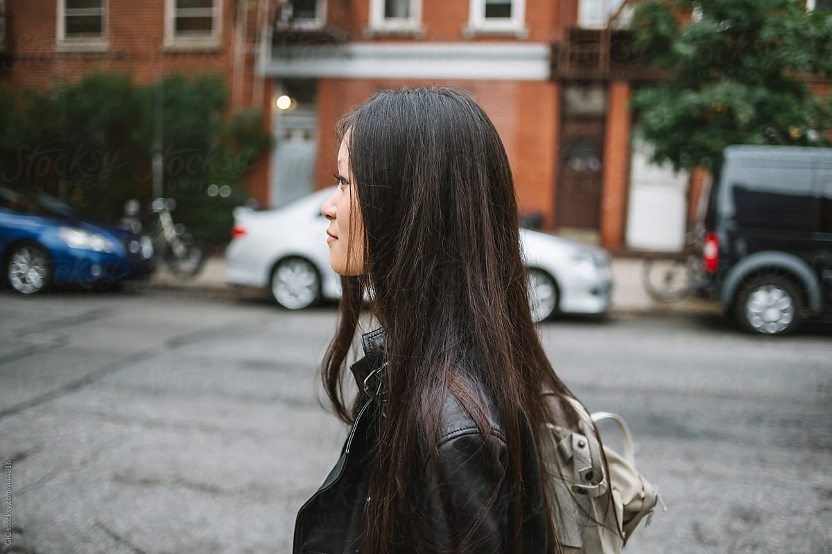 Asian girl walking in the city