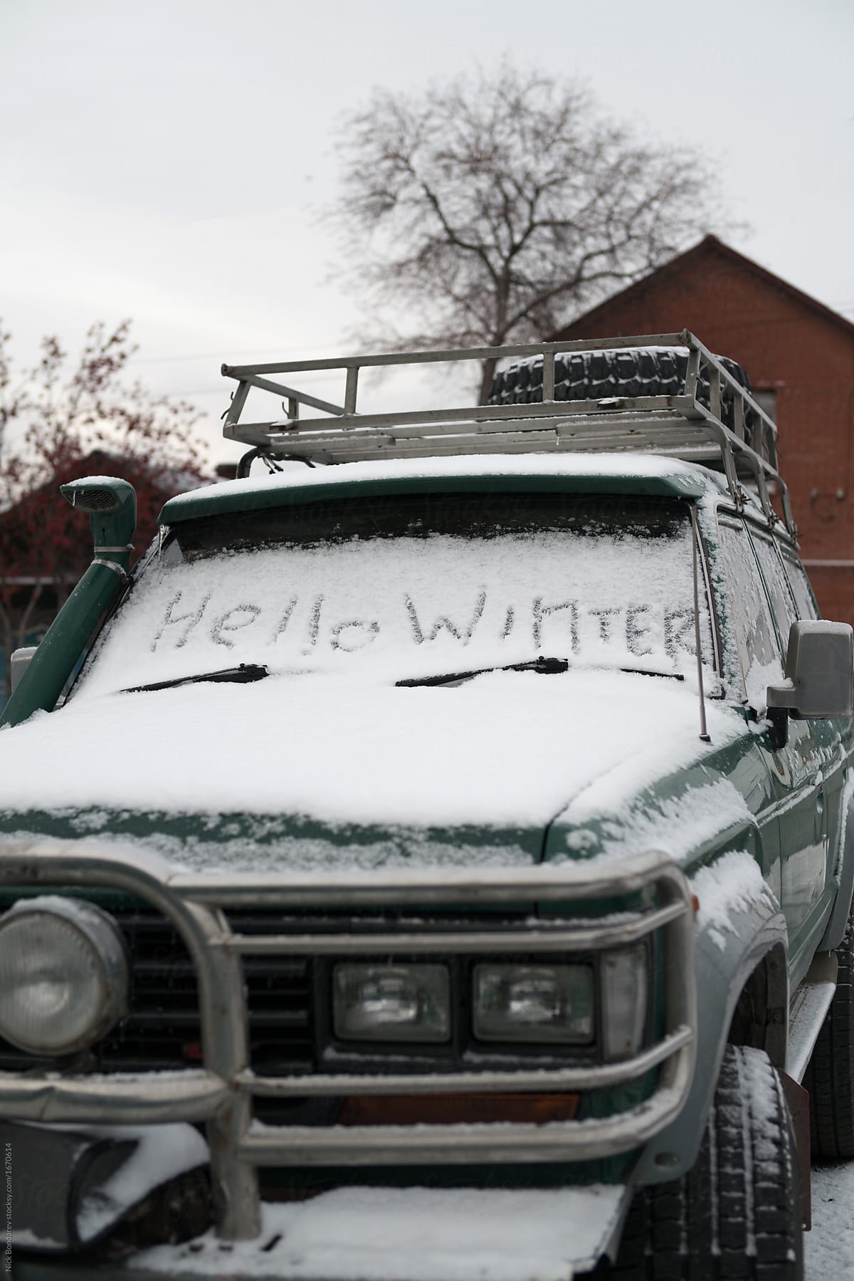 words hello winter on the snowy car in the first day of winter