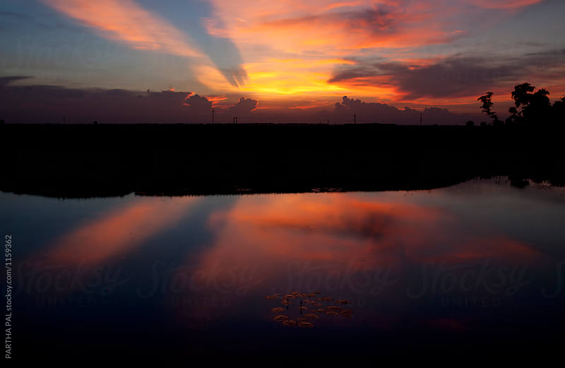 Colorful cloud at Sunset with reflection in water